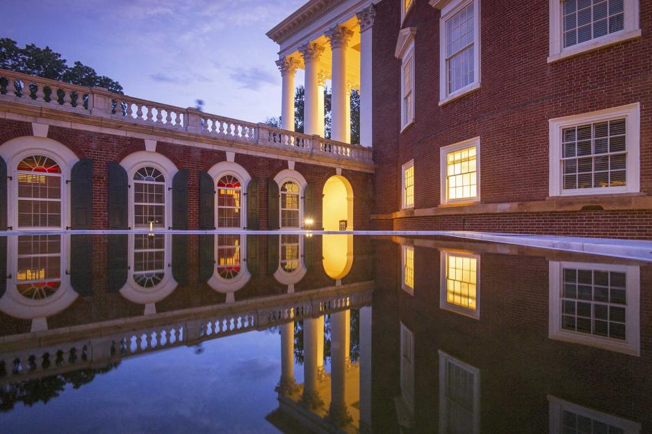 Reflection of the the side of the Rotunda in the Water that has pooled next to it.
