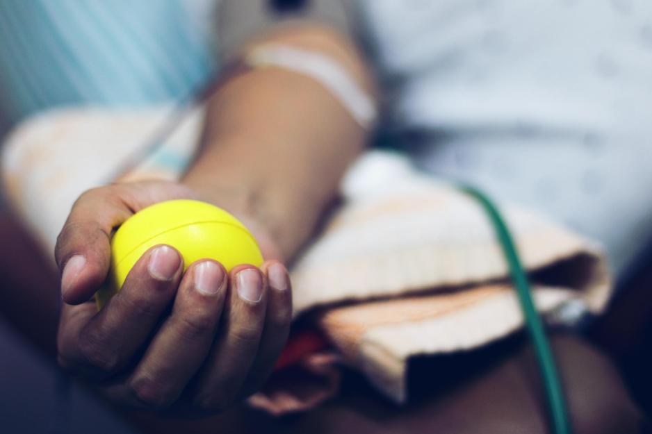 Patients hand holding a stress ball