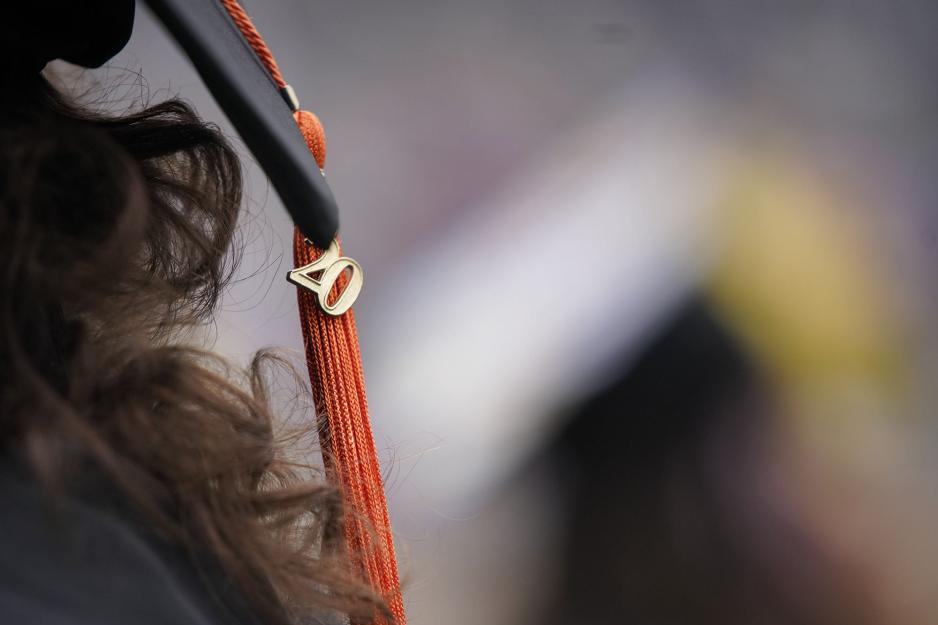 Graduation cap tassel with the number 20 hanging