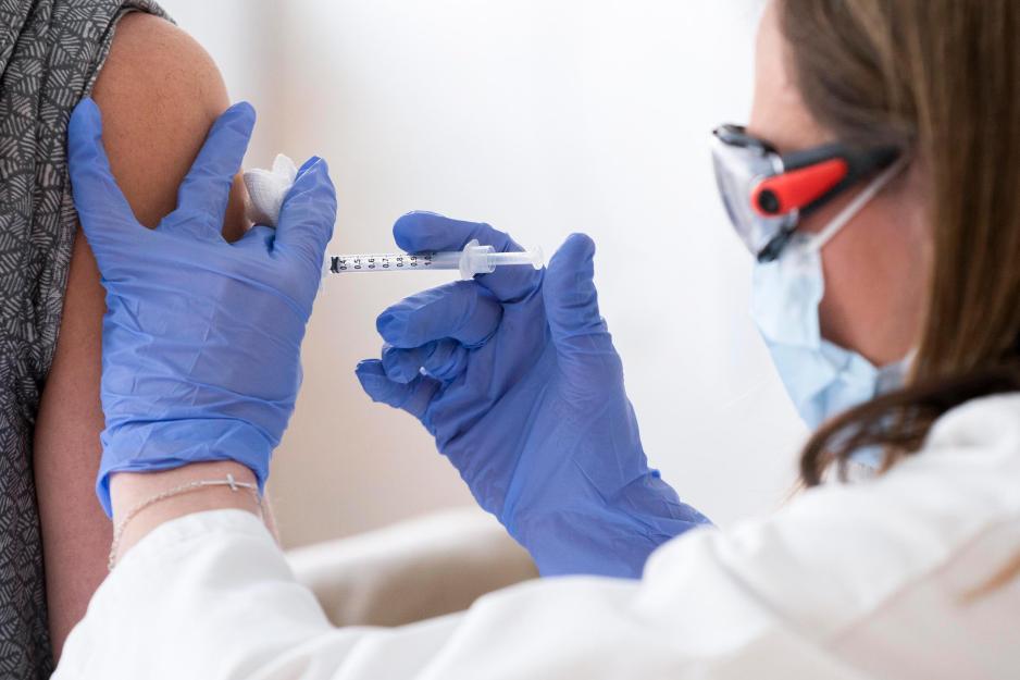 Healthcare provider giving an injection to a patient