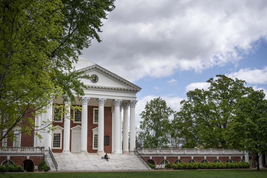 Person sitting on the steps of the Rotunda