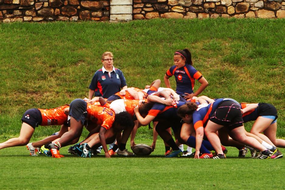 Woman's UVA Rugby team practicing on the field