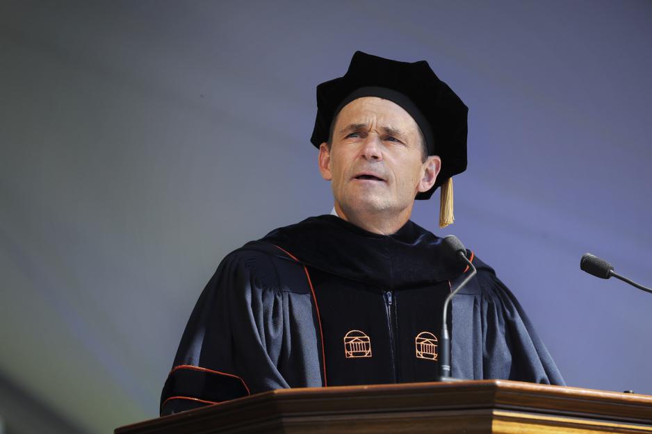 President Jim Ryan standing at a podium during final exercises giving a speech 