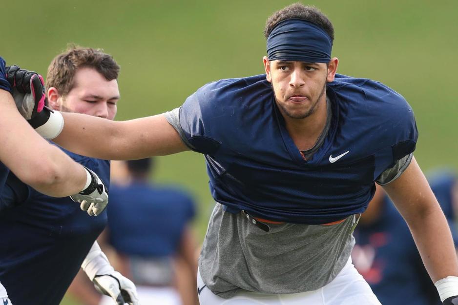 Ryan Swoboda pushing teammate during football practice