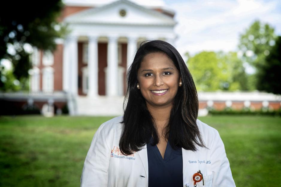 Dr. Sana Syed headshot in front of the Rotunda