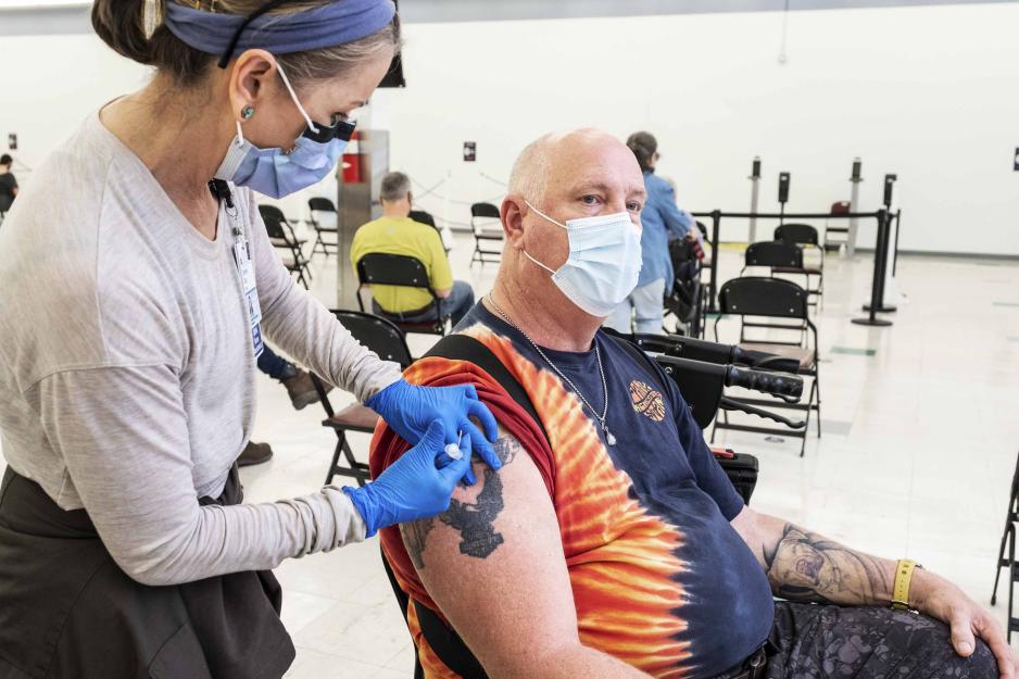 Healthcare professional giving a patient an injection