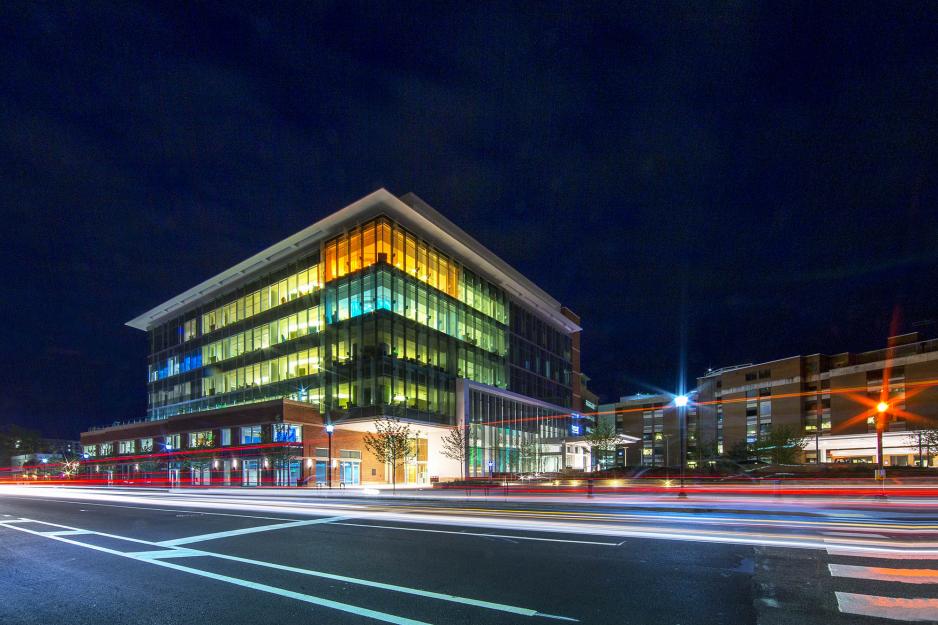 UVA Battle building lit up with various color lights