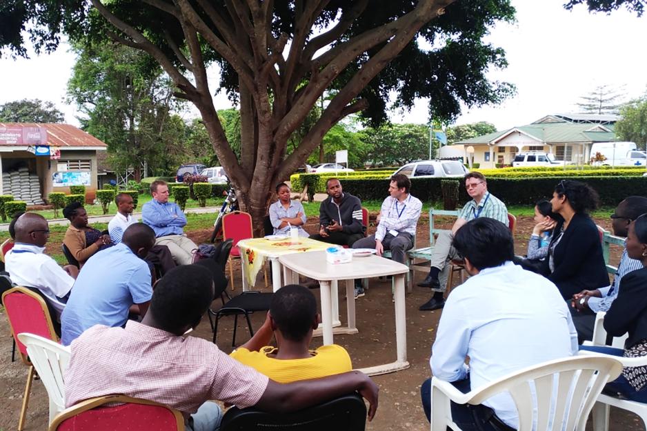 UVA doctors sit with doctors in the sub Saharan in a circle to talk