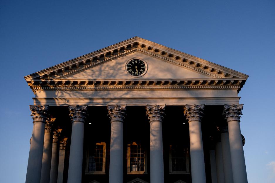 Town Hall building with shadows of trees on it as the sun sets at 5:30pm