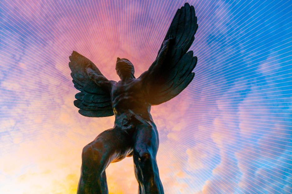 Flying man stature with the background being clouds that are blue, pink, and yellow
