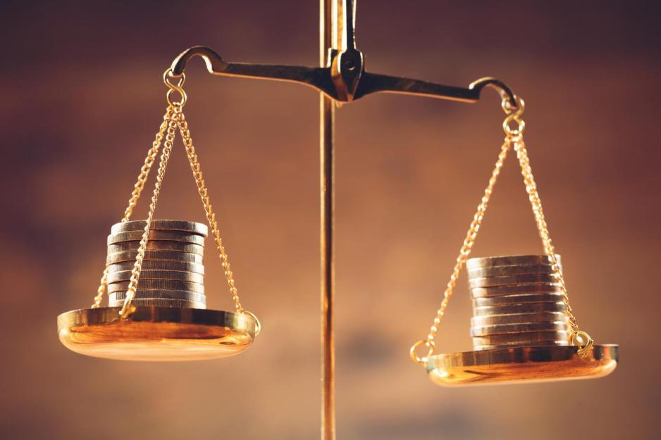 A balance with coins on each plate balanced