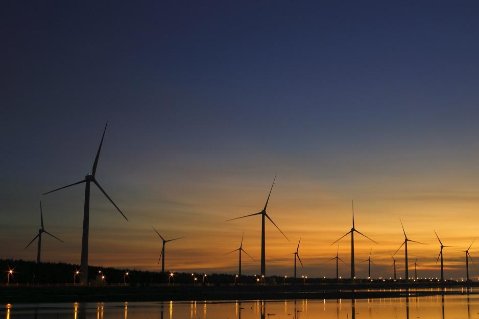 Windmills during a orange and blue sunset
