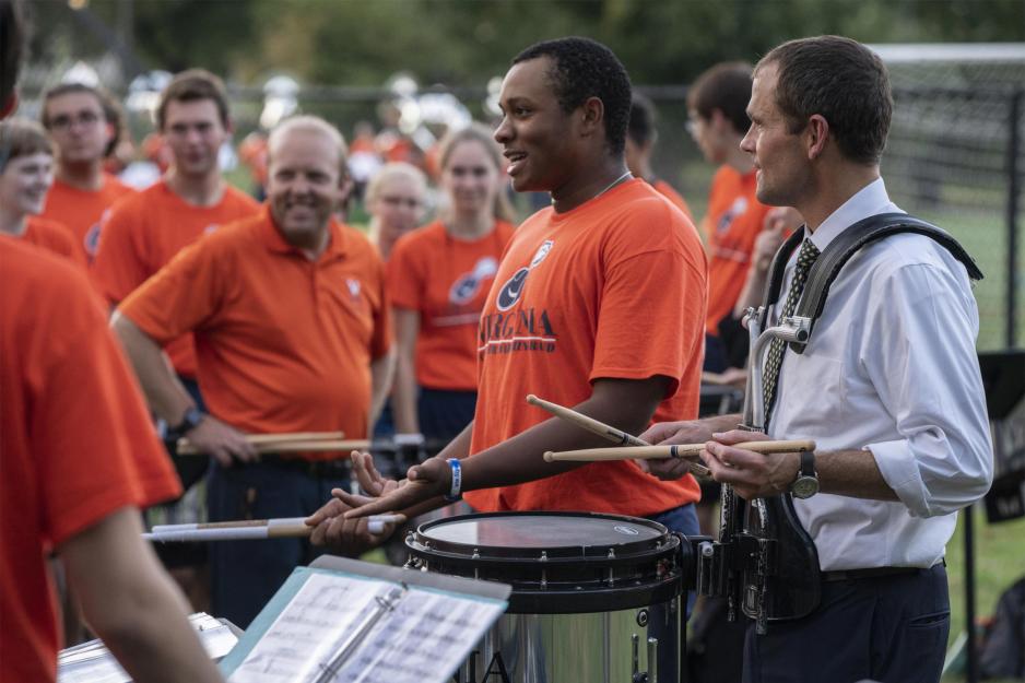President Jim Ryan plays a snare drum 