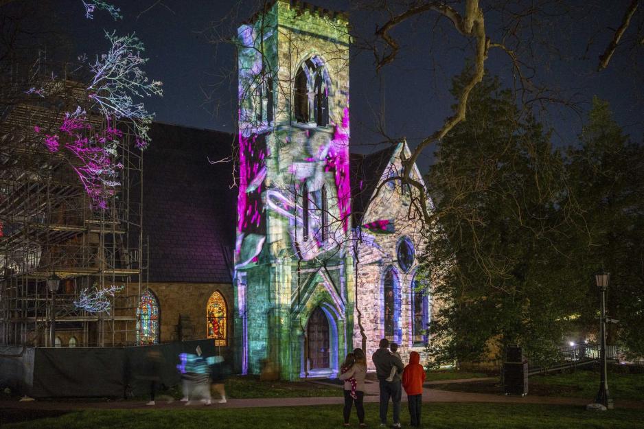 UVA Chapel Bell tower having multiple colors projected onto it.