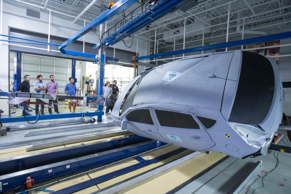  Car on its side in a crash test machine