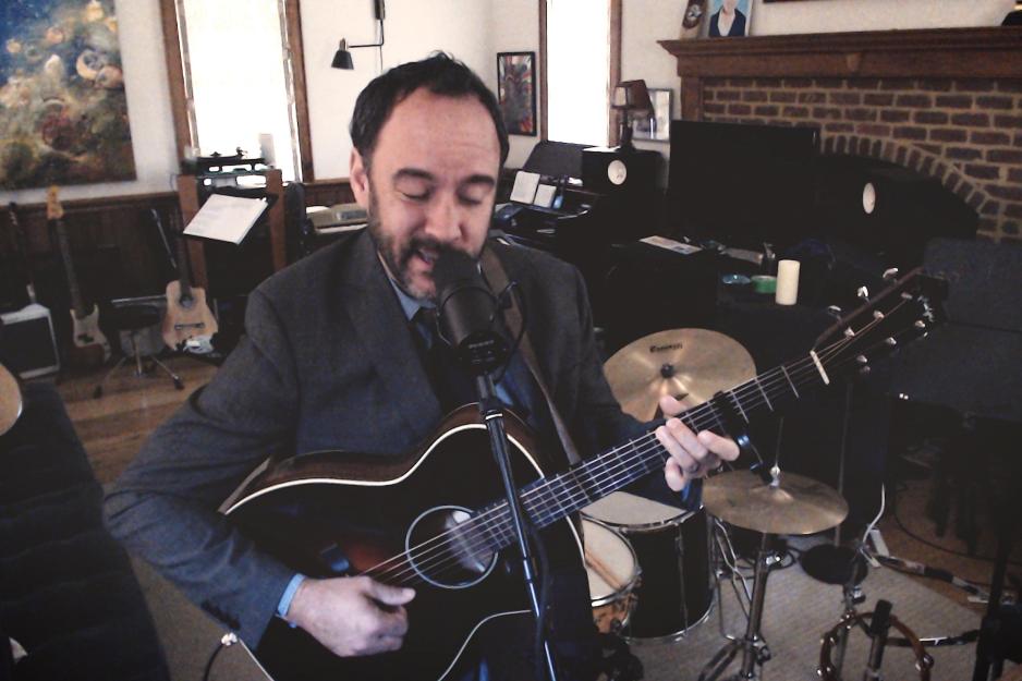 Dave Mathews singing and playing guitar