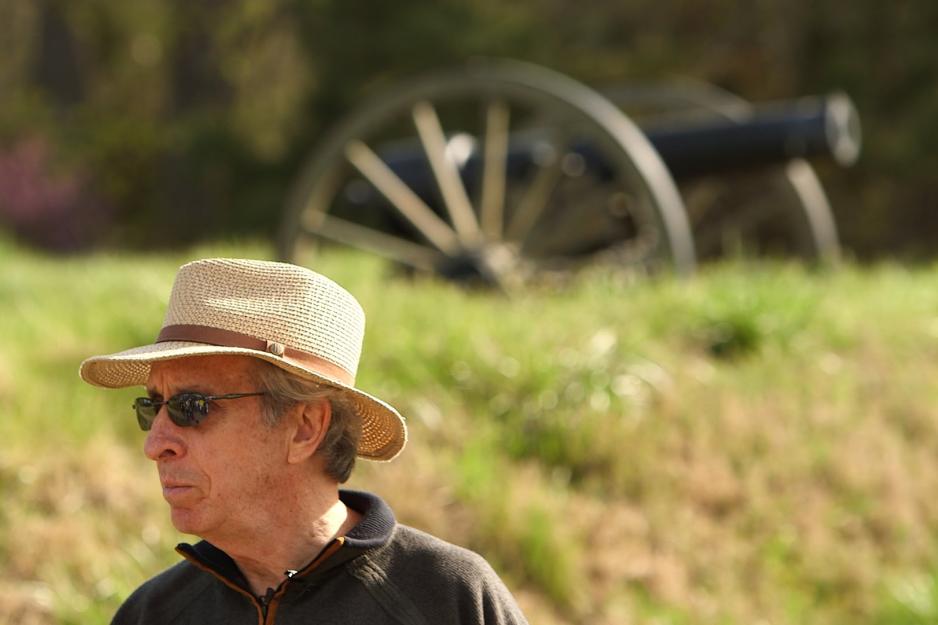  Gallagher standing in front of a cannon that is blurry in the background