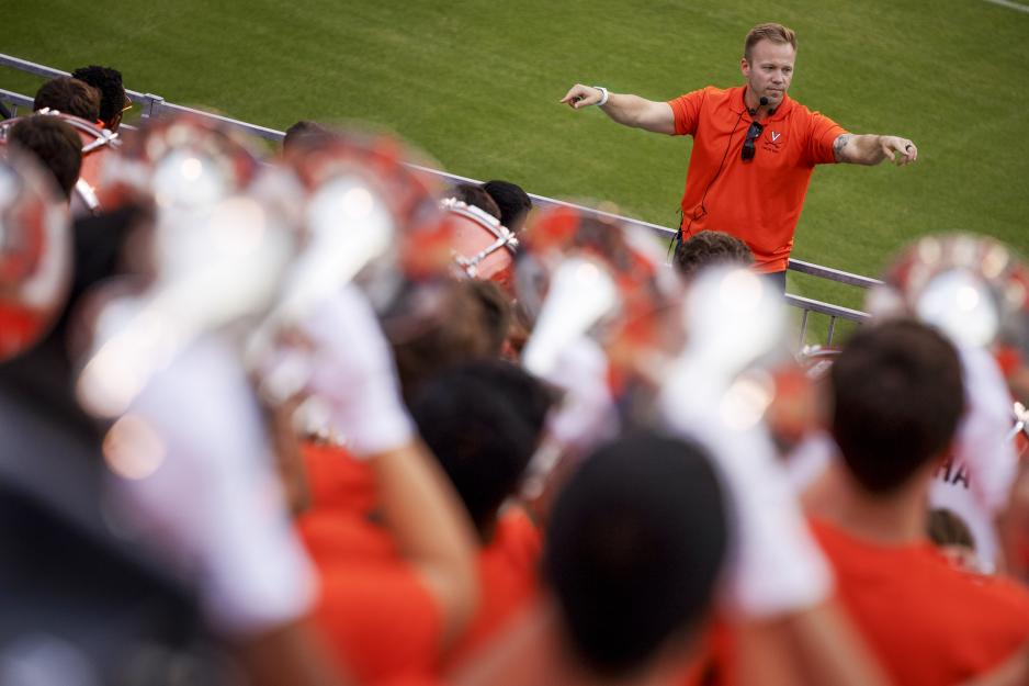 Elliott Trickitt directing the pep band at a football game