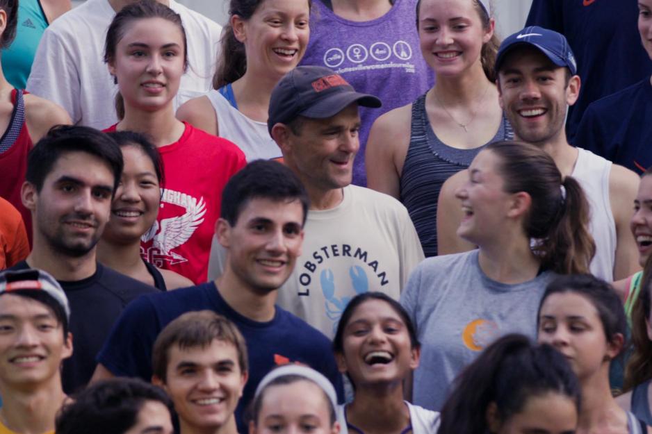 Jim Ryan in a crowd laughing with students