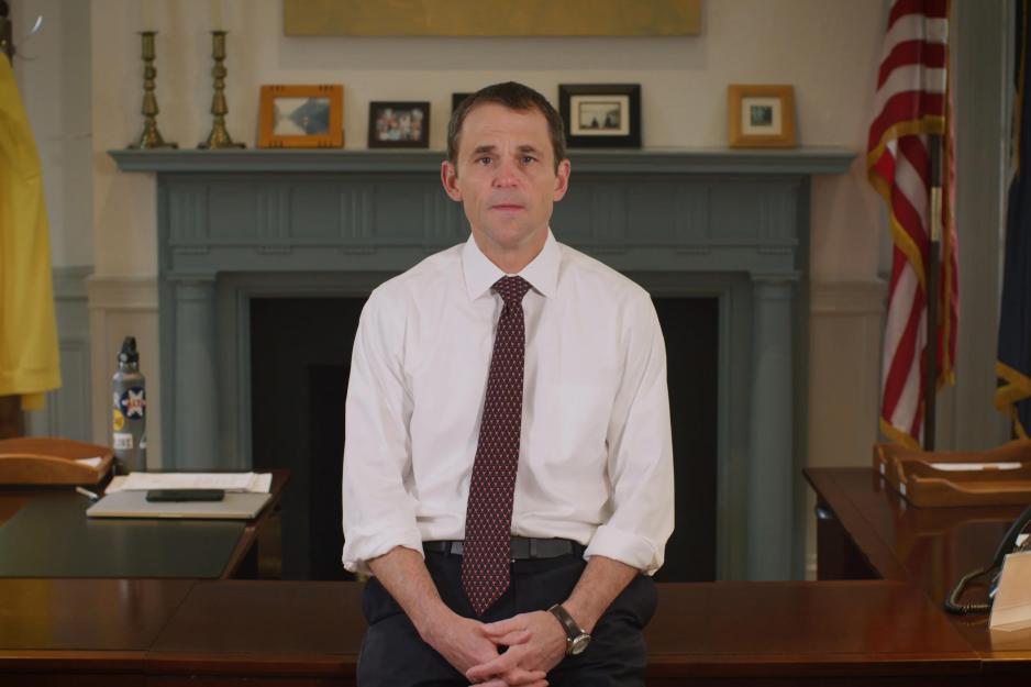 President Jim Ryan in his office speaking during a video announcement