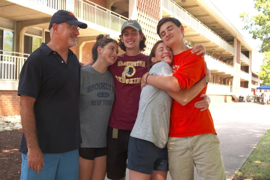  New student poses with parents and siblings