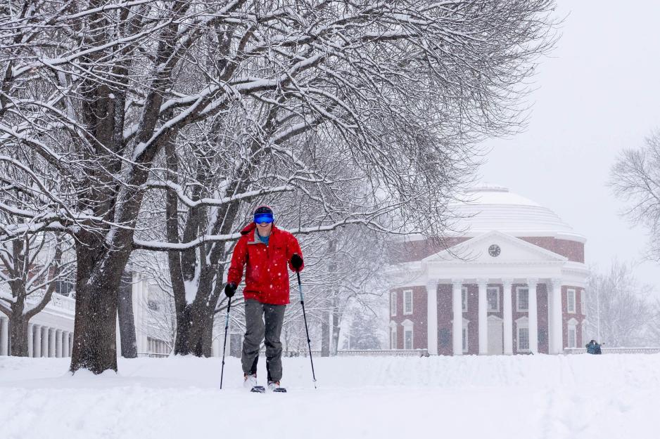Person skiing across the Lawn with the Rotunda as a backdrop