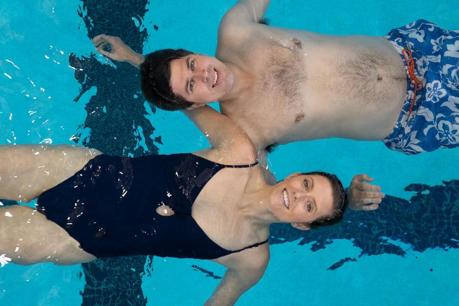 Bo and Megan Greenwood back float in the water for a picture