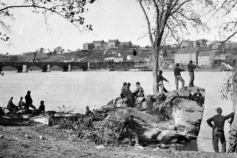 black and white image of Union soldiers on the bank of Mason’s Island