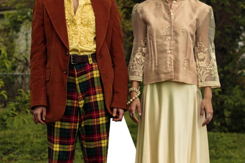 Two people  dressed in vintage clothing