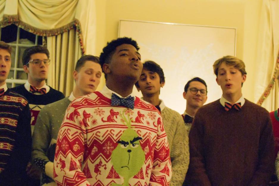 The Virginia Gentlemen sing a song together at a holiday party