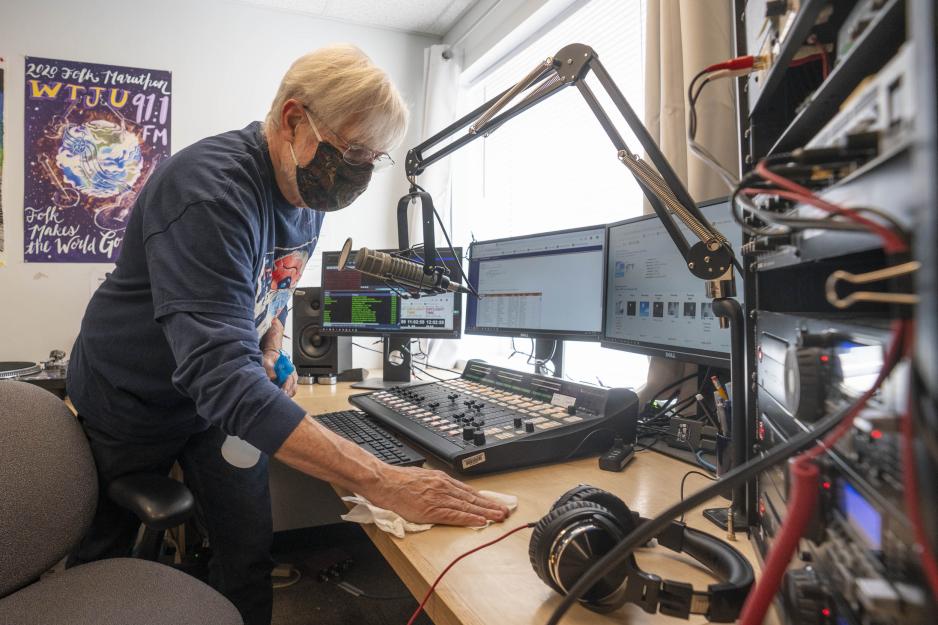 Dave Rogers wipes down the broadcast station