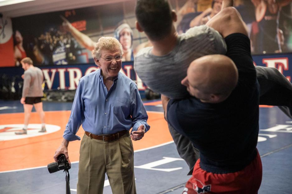 John Dobbins, left, watch Steve Garland wrestling with another person