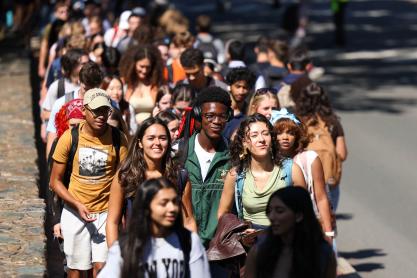 students walking along McCormick Road at UVA