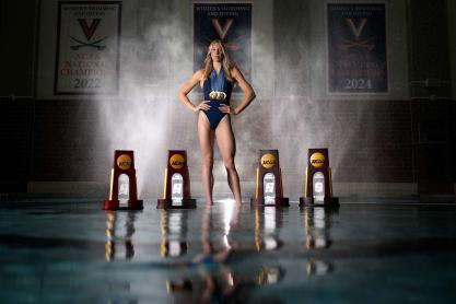Gretchen Walsh at the UVA pool with her four NCAA Championship trophies and four Olympic medals
