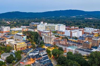 aerial photo of UVA Medical Center and surrounding buildings at dusk