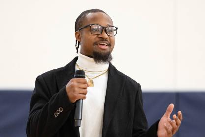 Perris Jones speaking in front of a crowd