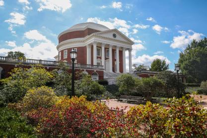 looking up at the UVA Rotunda and front landscaping on a bright afternoon.