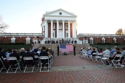 Cadets, midshipmen and guests, including University President Jim Ryan, attend a Veterans Day ceremony on the north plaza of the Rotunda 