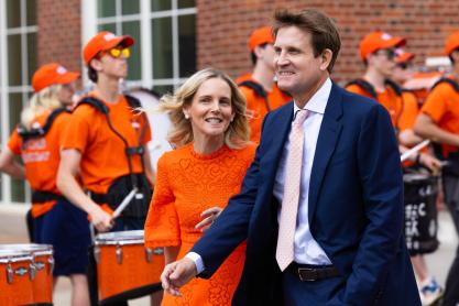 Portrait of Carrie and Chris Shumway prepare to enter the new Shumway Hall at the McIntire School of Commerce.