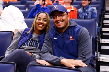 Tamika Elliot and Tony Elliot sitting in John Paul Jones arena at UVA
