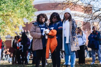 Members of the UVA community standing on the Lawn in mourning