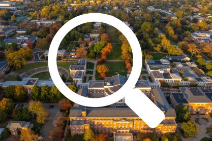 Illustration of a magnifying glass over an aerial photo of the Lawn in the fall from the New Cabel side.