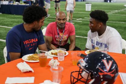 William Frazier Jr. chatting with UVA football players