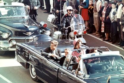 President Kennedy being escorted in a car