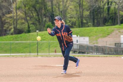 Risa Goluboff throwing a softball