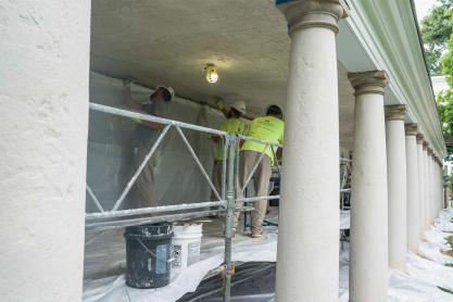 Builders working on the Colonnade plaster