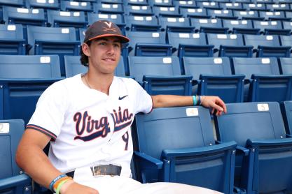 Portrait of Henry Ford in his UVA baseball jersey sitting in the stands