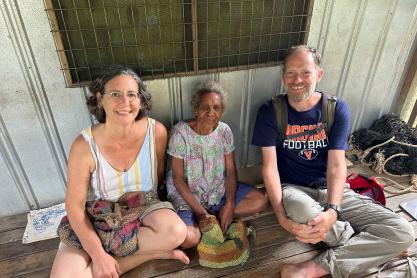 UVA researchers sit with Village elder