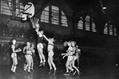 Black and White photo of UVA mens basketball team playing during a game