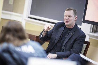 Bronco Mendenhall talking to a group of students